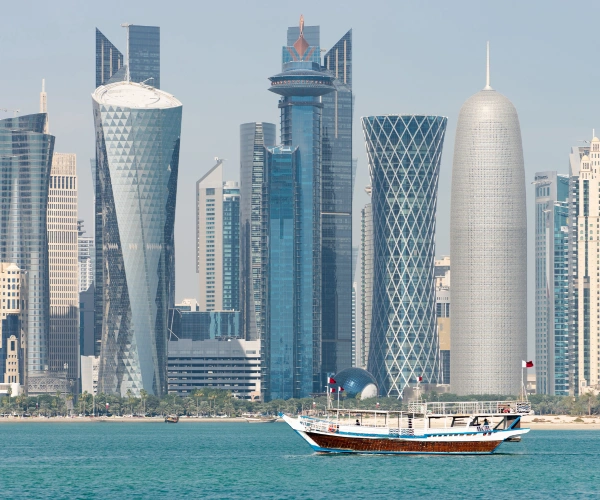 skyscrapers-city-center-with-water-boat-foreground-doha-qatar